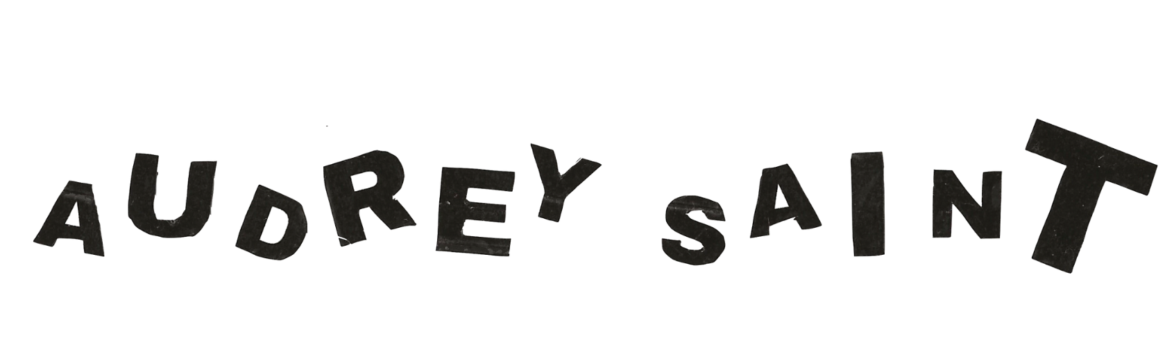 Header of black text reading "Audrey Saint" in scattered, randomly sized block letters. 